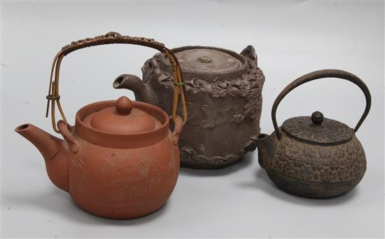 Three Oriental teapots, tallest 11.5cm